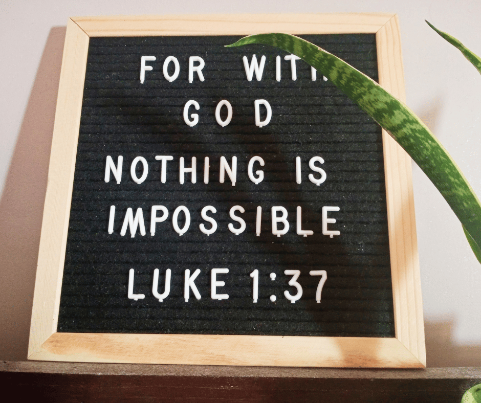 The bible verse Luke 1:37 written on a board