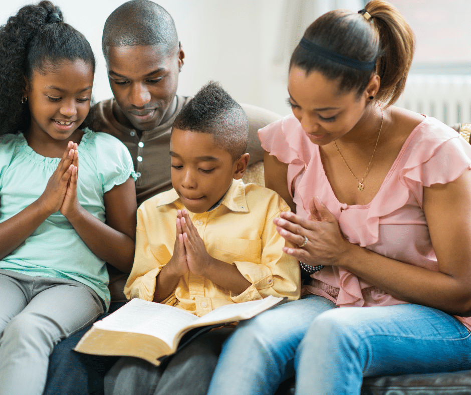 a Christian Family reading the bible together