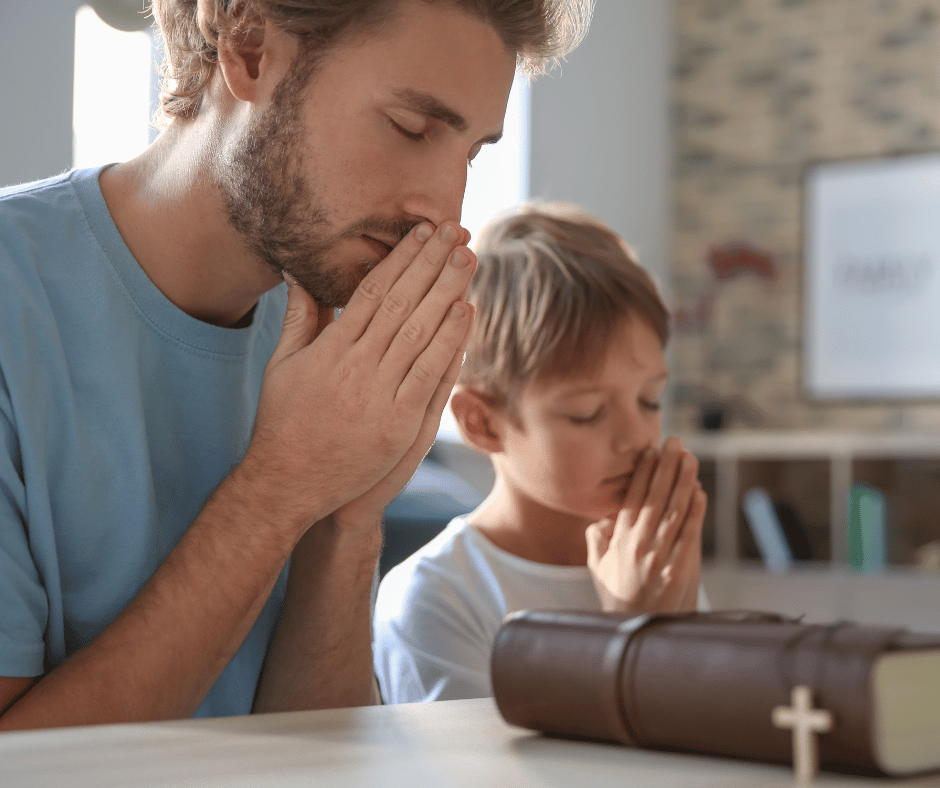 a father and son praying together 