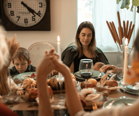 A family saying a Christian Thanksgiving prayer